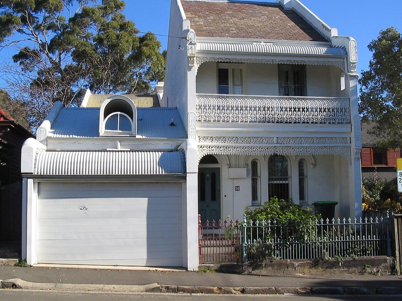 Two-storey Victorian terrace with iron-lace balcony