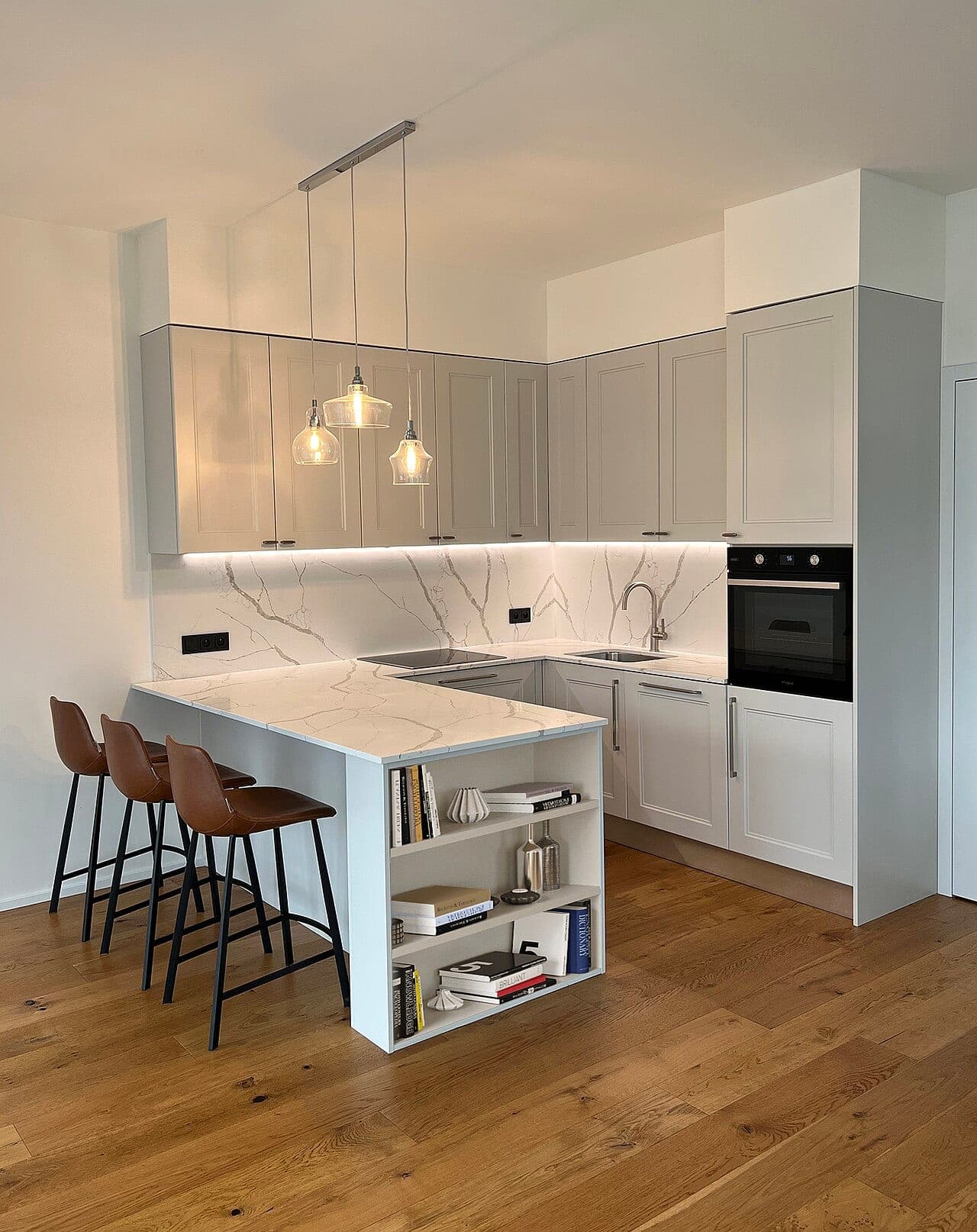 White kitchen with island and bar stools
