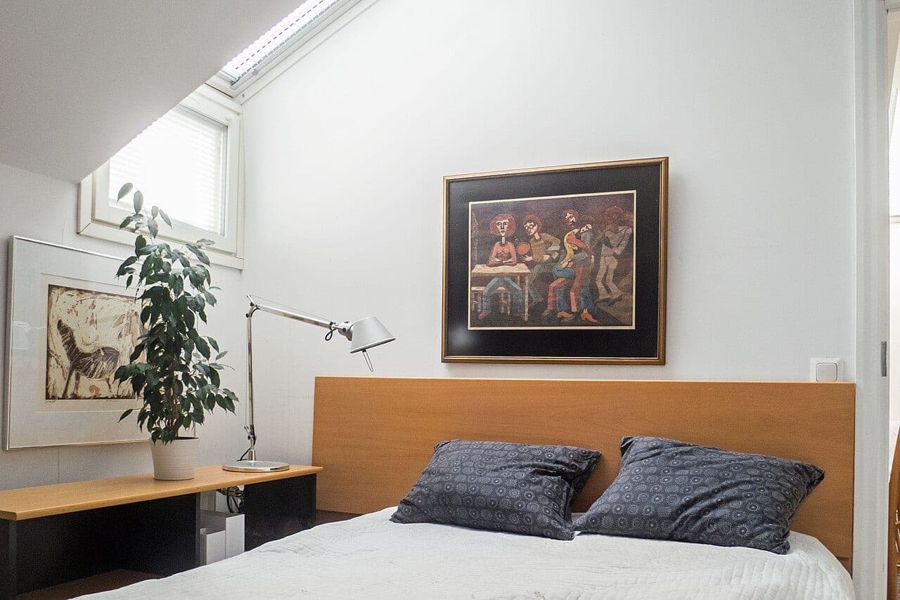 Mezzanine bedroom under a skylight