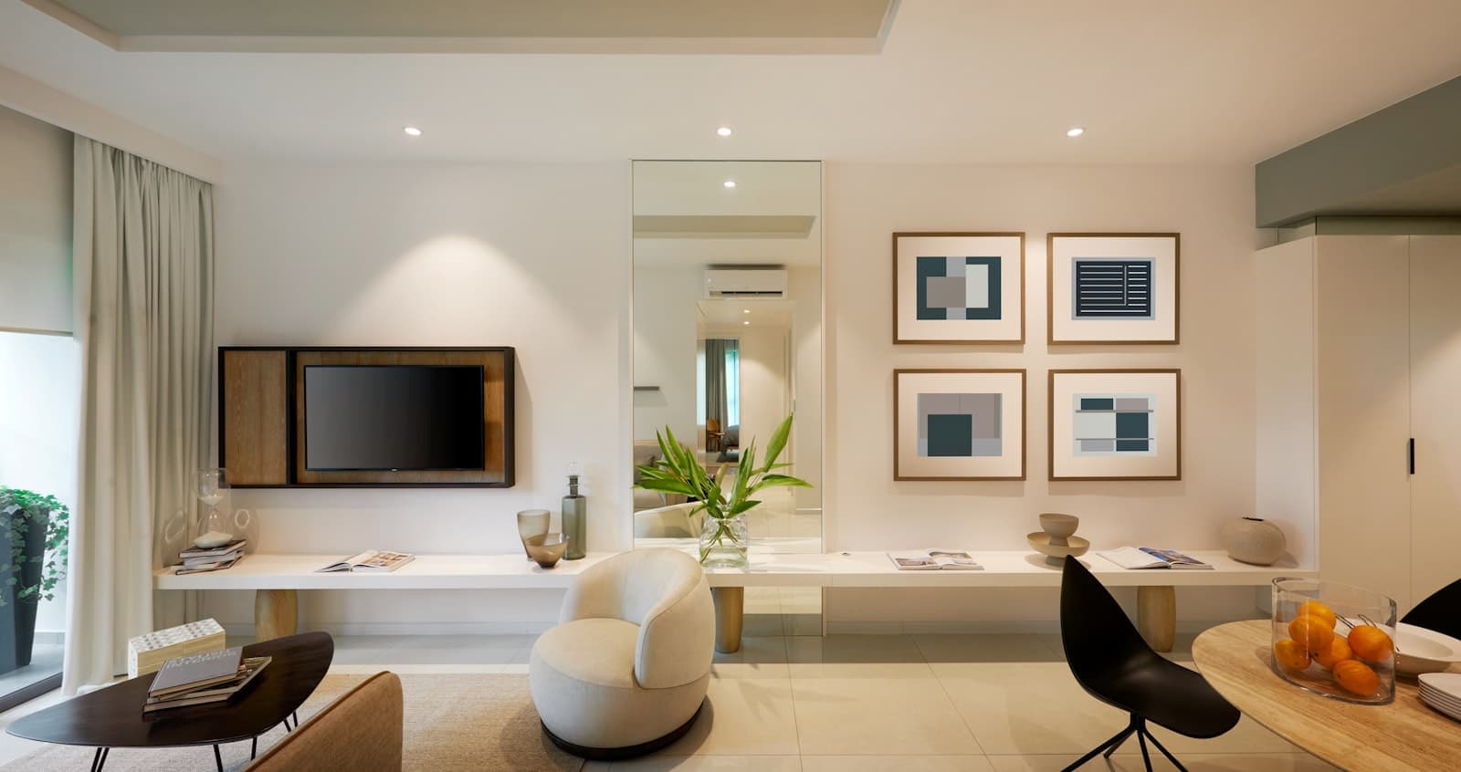 Living room with a wall-mounted television and a round armchair